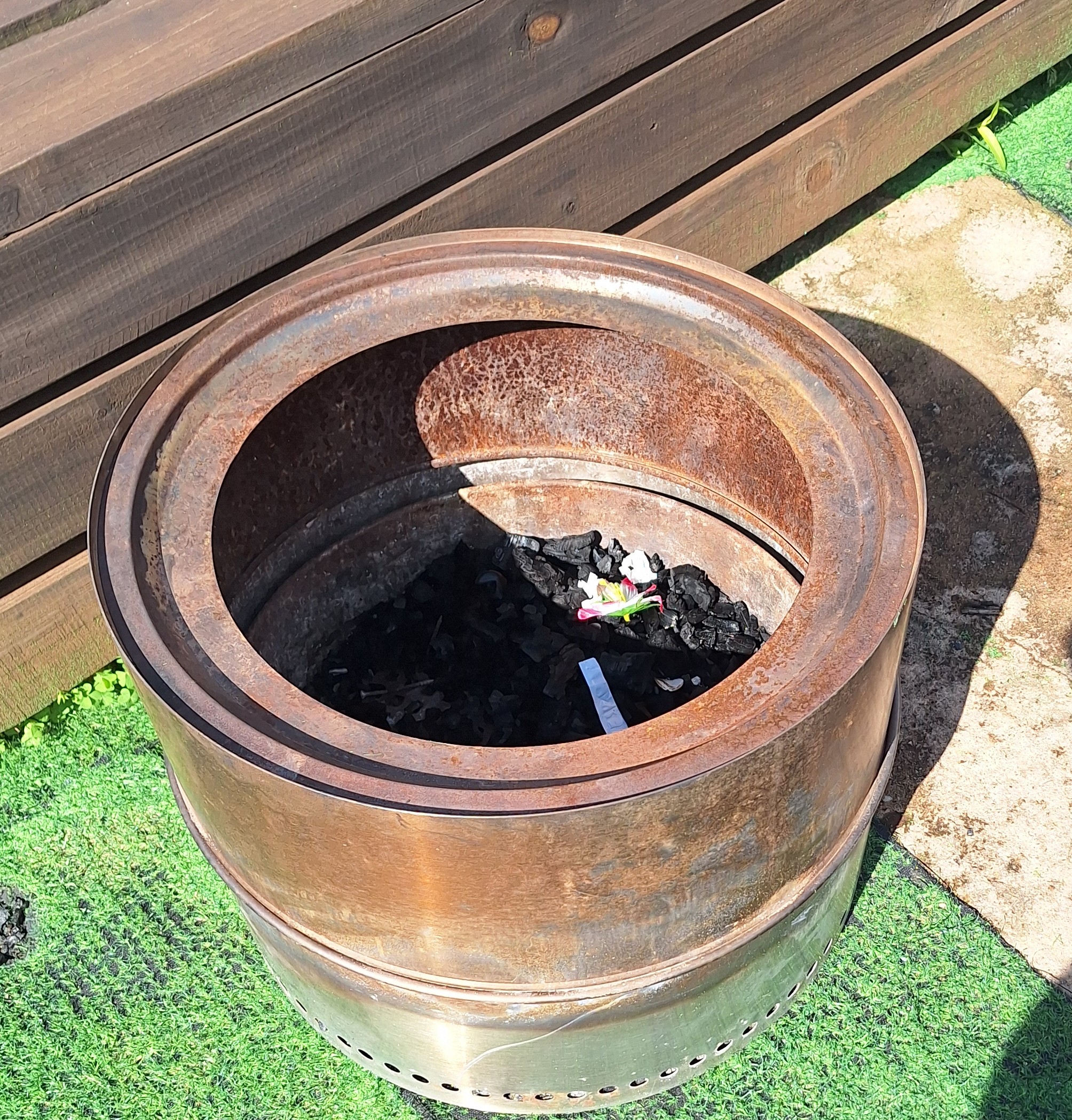 Used stainless steel fire pit after heat exposure
